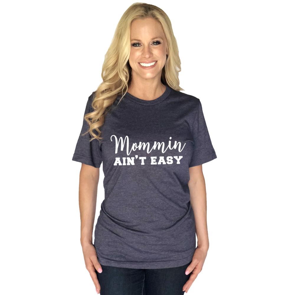 Mommin Ain't Easy women's t-shirt from Katydide with model wearing navy color