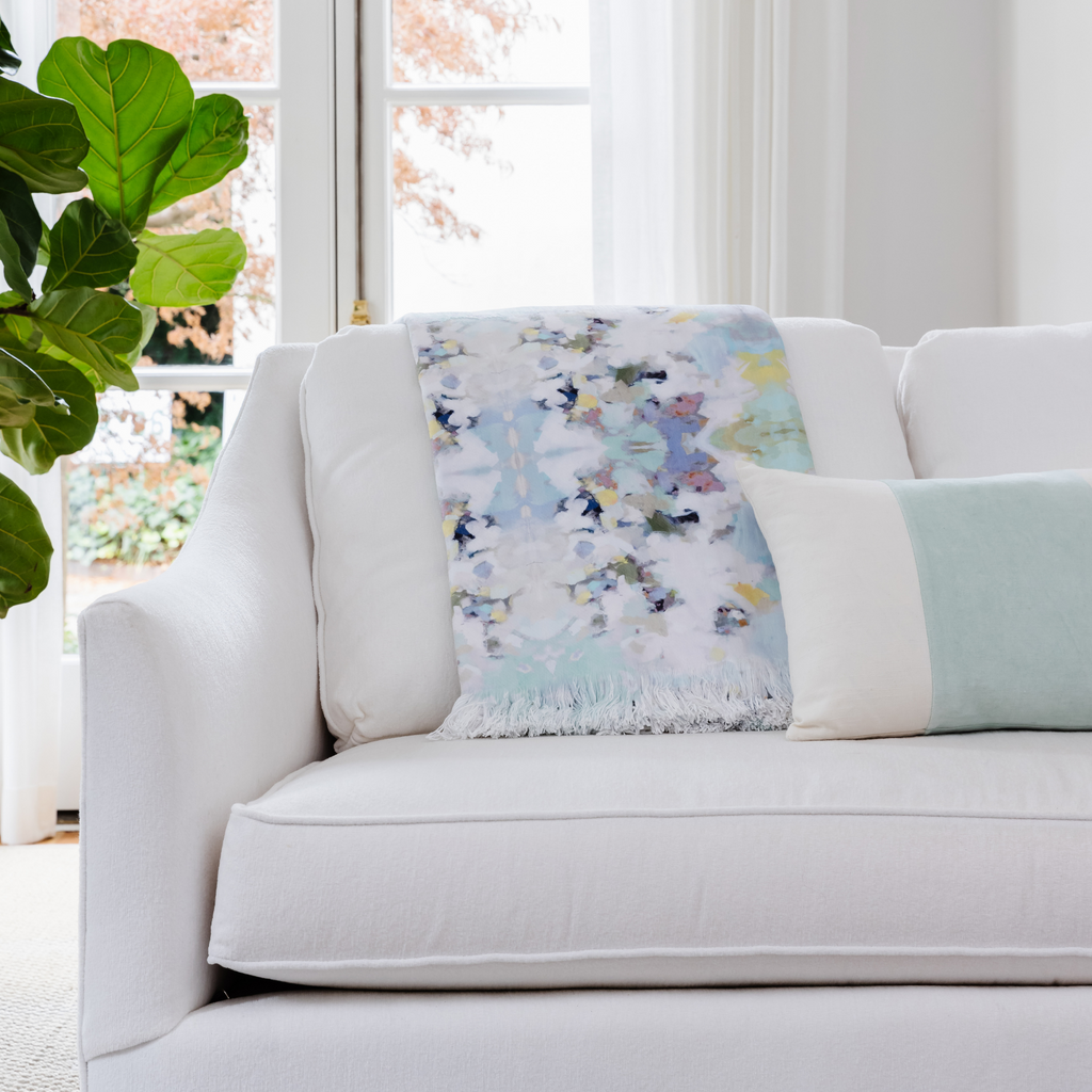 Lady Bird Throw Blanket displayed on sofa
