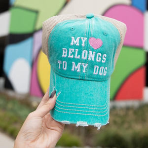My Heart Belongs To My Dog women's trucker hat in teal from Katydid in models hand
