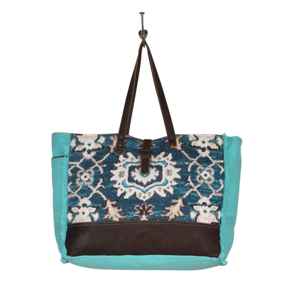 Vivacious Weekender Bag Hanging on Hook Image Myra Bag Harley Butler Trading Company