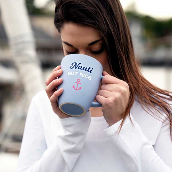 Nauti But Nice Cup in light blue matte finish with slogan woman with cup