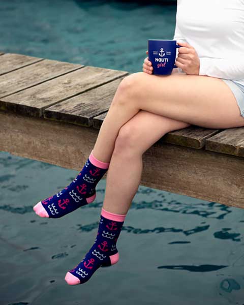 Nauti Girl Cup 20 oz. stoneware matte blue finish with slogan woman with cup on pier