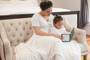 Bamboo Blanket Oversized King - Pristine White shown with mother reading to daughter