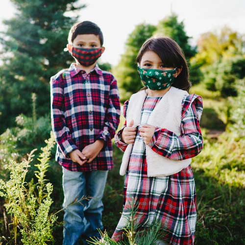 Reindeers & Snowflakes kid's face mask red-nose reindeers and snowflakes young children outdoors