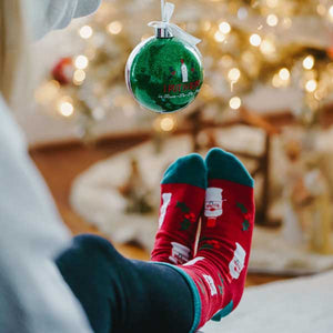 Rum-Pa-Pa-Pum Christmas socks and ornament woman wearing socks