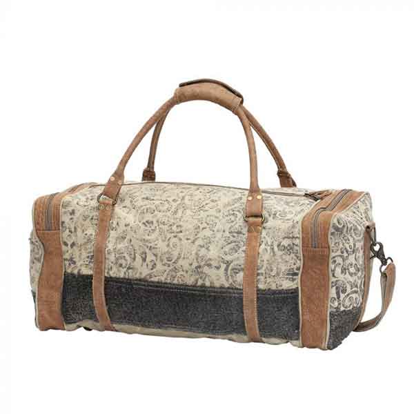 Floral print & hairon traveler bag with zippered compartments from Myra Bag front view