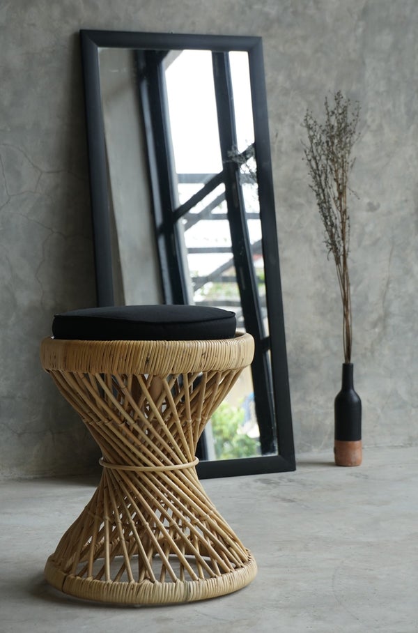 Vintage Rattan Stool displayed as an accent