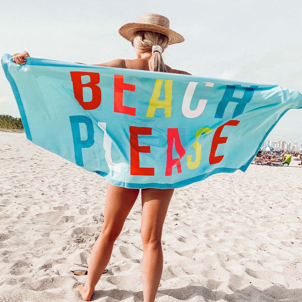 Beach Please Beach Towel held by woman on beach