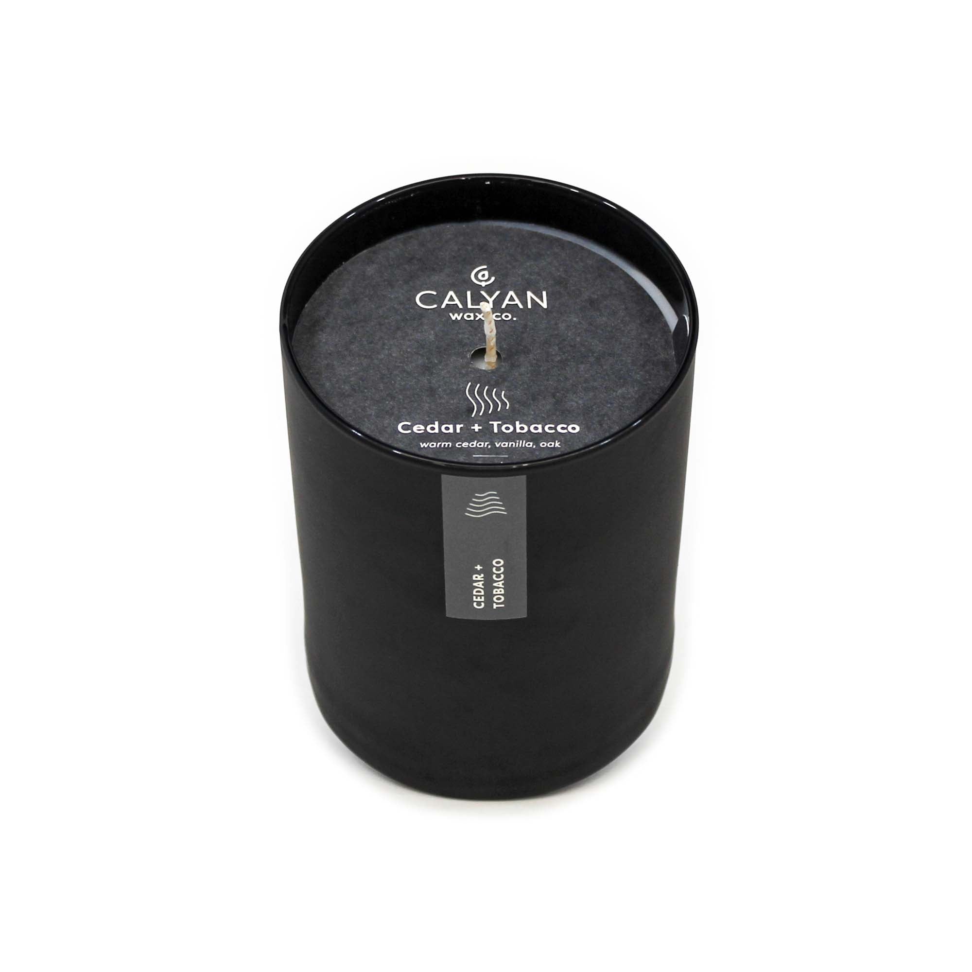 Black matte glass tumbler candle Cedar + Tobacco fragrance from Calyan Wax Company
