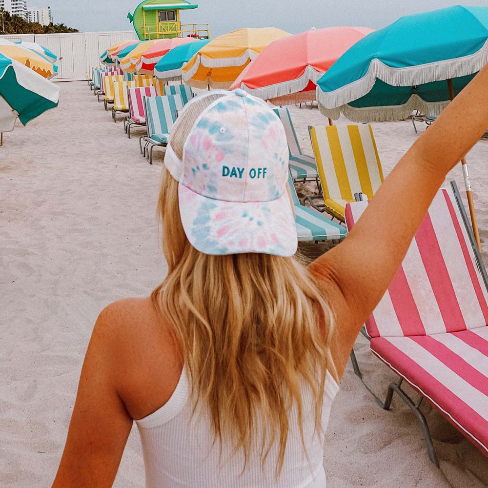 Girl wearing the Day Off Tie Dye Baseball Cap at the beach