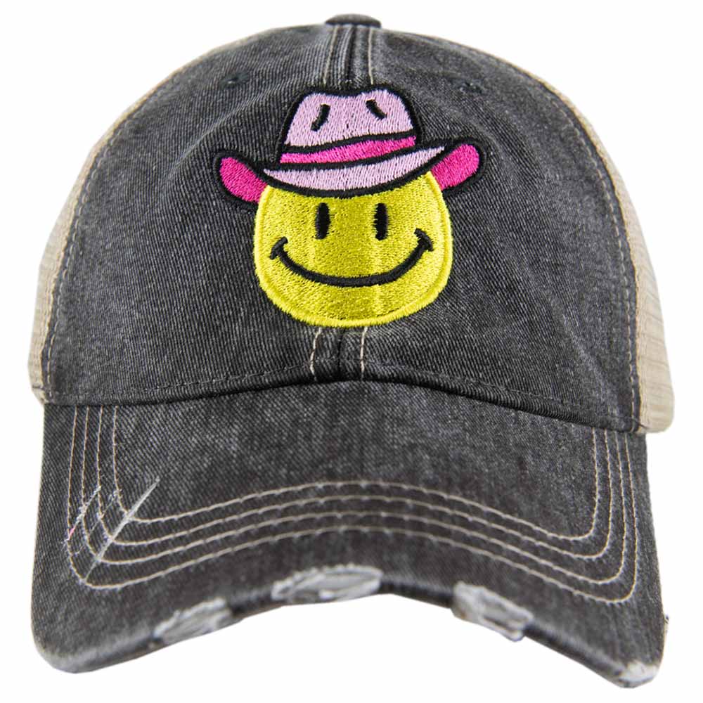 Cowboy Hat Happy Face Trucker Hat has a pink cowgirl hat on the yellow happy face