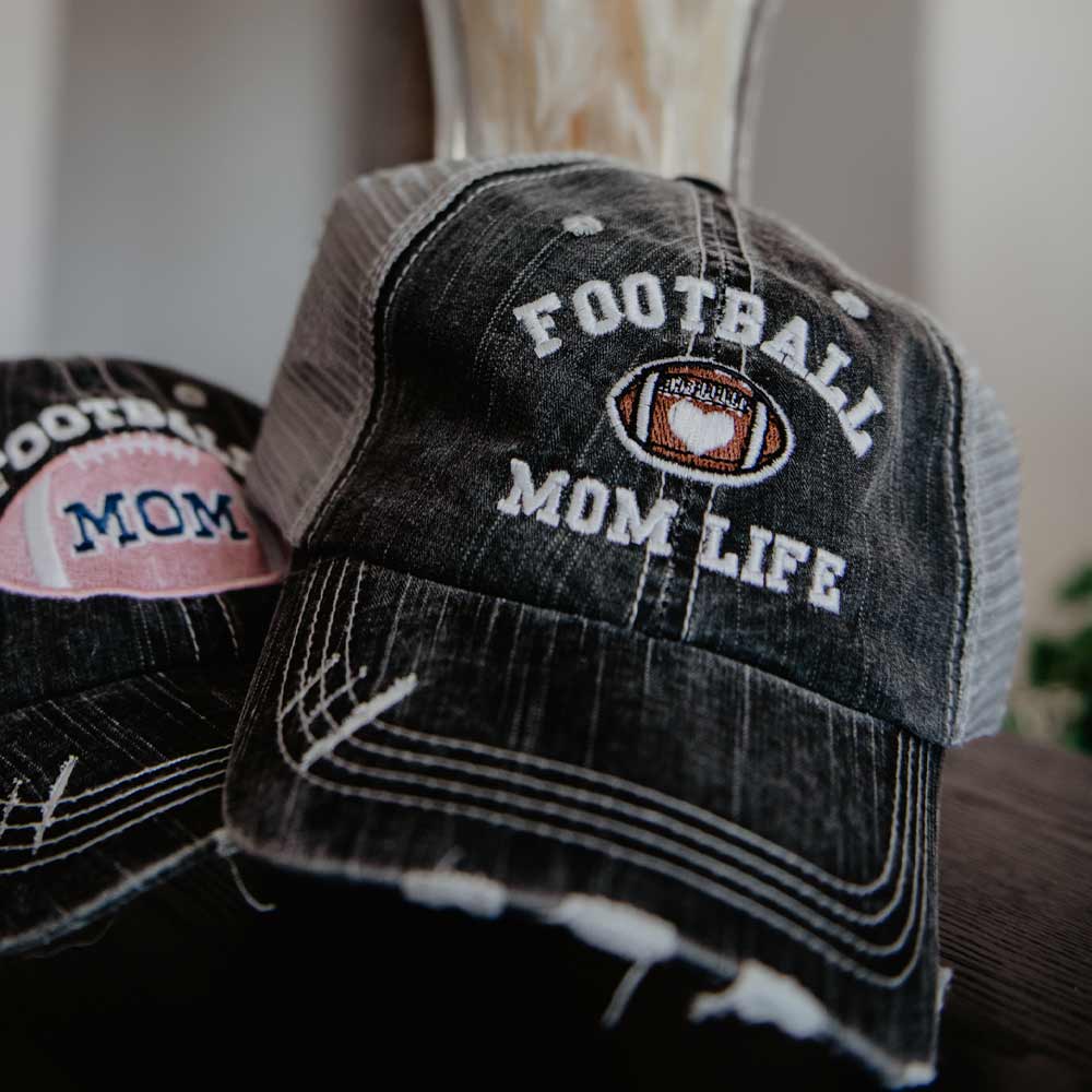 Football Mom Life Trucker Hat with embroidered football and heart, from Katydid
