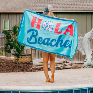 Hola Beaches Quick Dry Beach Towel in blue with bold lettering message