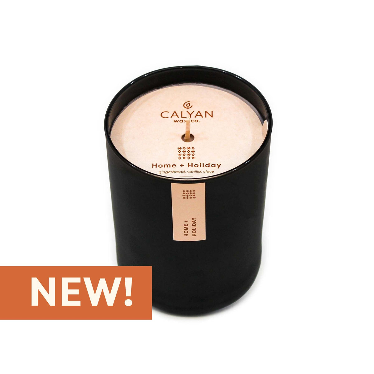 Black glass candle tumbler in Home + Holiday fragrance from Calyan Wax Co.